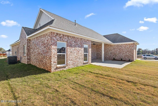 840 Glenwild Cir, Canton, MS 39046 - rear view of property with a patio area, brick siding, board and batten siding, and a lawn