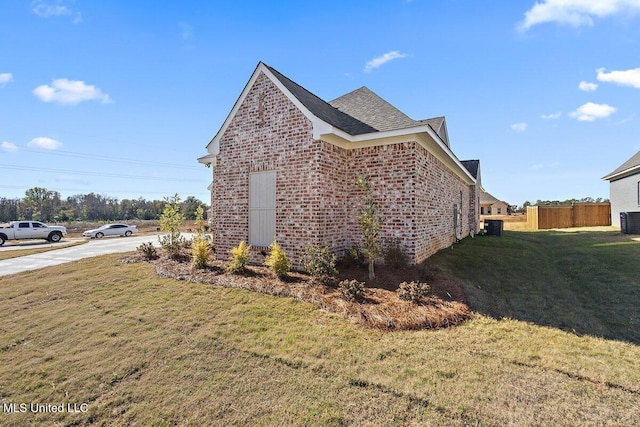 840 Glenwild Cir, Canton, MS 39046 - view of property exterior featuring brick siding, central AC unit, and roof with shingles