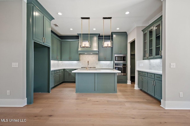 840 Glenwild Cir, Canton, MS 39046 - kitchen featuring stainless steel appliances, tasteful backsplash, light countertops, green cabinetry, and recessed lighting