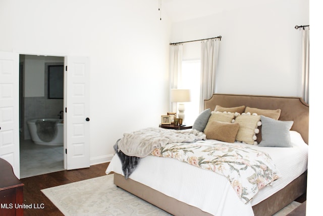 bedroom featuring wood finished floors