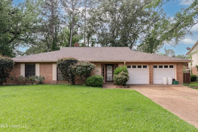504 Hampton St, Clinton, MS 39056 - ranch-style house with an attached garage, concrete driveway, brick siding, a front yard, and a chimney