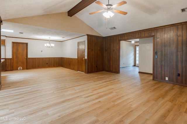 504 Hampton St, Clinton, MS 39056 - empty room featuring ceiling fan, wooden walls, a chandelier, light wood finished floors, and a wainscoted wall