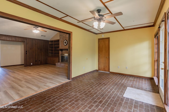 504 Hampton St, Clinton, MS 39056 - unfurnished living room with ceiling fan, a fireplace, brick patterned floors, baseboards, and ornamental molding