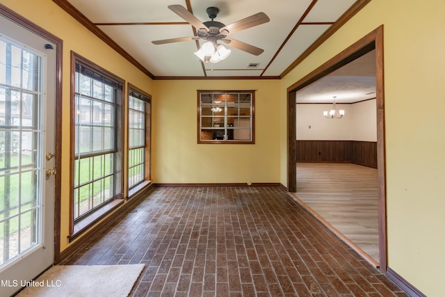 504 Hampton St, Clinton, MS 39056 - unfurnished room with ornamental molding, a chandelier, brick patterned floors, plenty of natural light, and baseboards