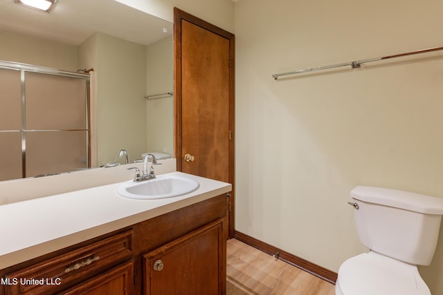 504 Hampton St, Clinton, MS 39056 - bathroom with toilet, an enclosed shower, baseboards, and vanity