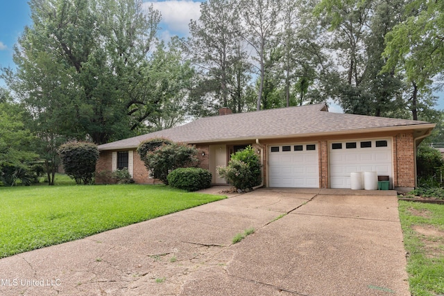 504 Hampton St, Clinton, MS 39056 - single story home featuring an attached garage, brick siding, driveway, a front lawn, and a chimney