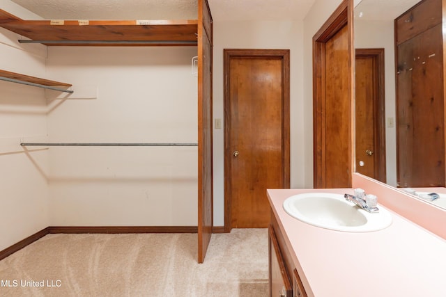 504 Hampton St, Clinton, MS 39056 - bathroom with vanity and baseboards