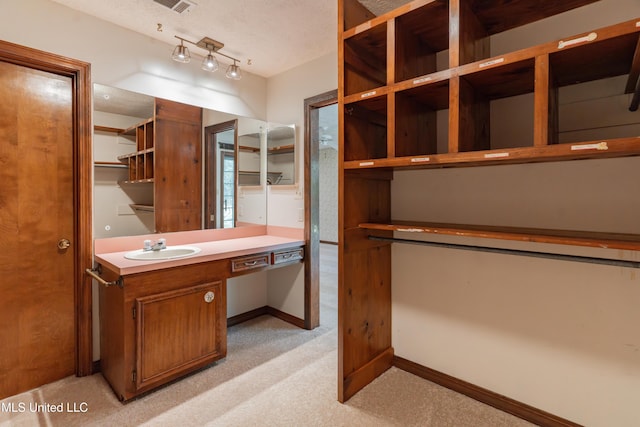 504 Hampton St, Clinton, MS 39056 - bathroom featuring baseboards and vanity
