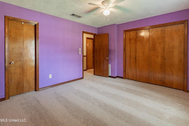504 Hampton St, Clinton, MS 39056 - unfurnished bedroom with carpet flooring, baseboards, and a textured ceiling
