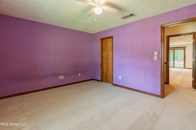 504 Hampton St, Clinton, MS 39056 - carpeted empty room featuring ceiling fan, baseboards, and a textured ceiling