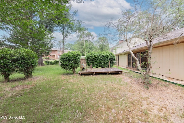 504 Hampton St, Clinton, MS 39056 - view of green lawn with a wooden deck