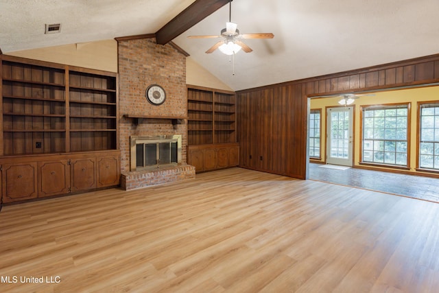 504 Hampton St, Clinton, MS 39056 - unfurnished living room with ceiling fan, light wood-style floors, built in features, and a fireplace