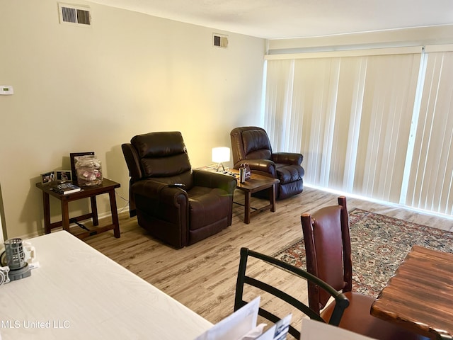 living area with hardwood / wood-style floors