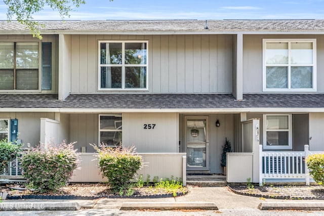 257 Highpoint Dr Unit 257, Diamondhead, MS 39525 - multi unit property with a porch and a shingled roof