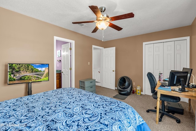 257 Highpoint Dr Unit 257, Diamondhead, MS 39525 - bedroom featuring carpet floors, a ceiling fan, a closet, an office area, and a textured ceiling