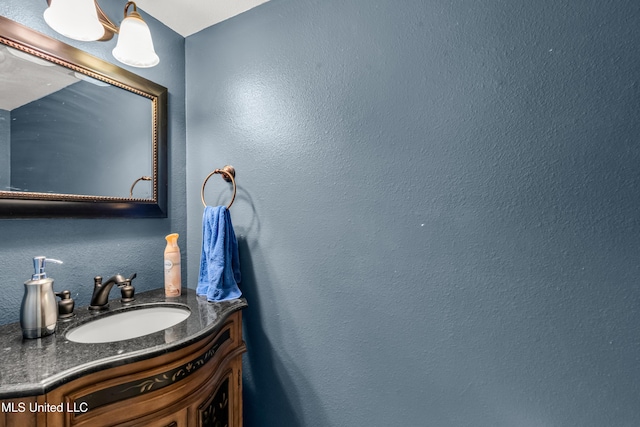 257 Highpoint Dr Unit 257, Diamondhead, MS 39525 - bathroom with vanity and a textured wall