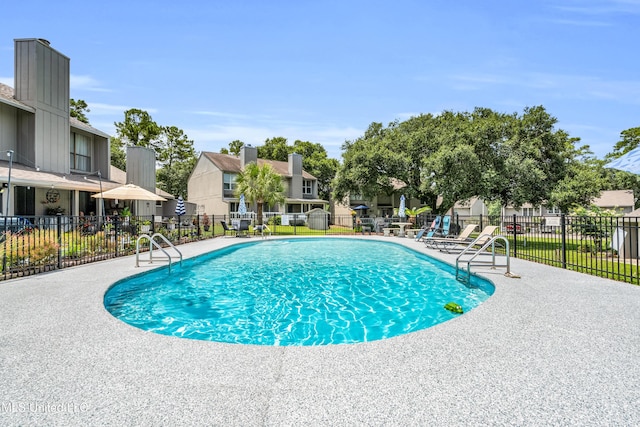 257 Highpoint Dr Unit 257, Diamondhead, MS 39525 - community pool featuring a residential view and a patio