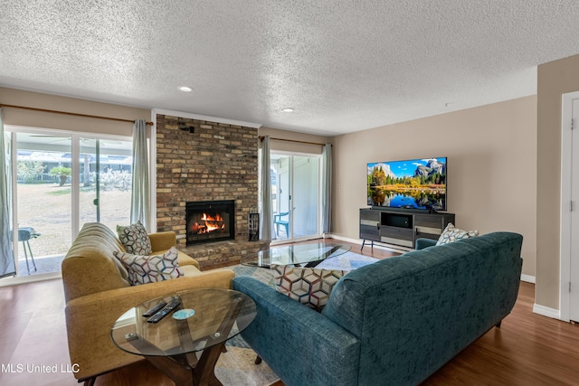 257 Highpoint Dr Unit 257, Diamondhead, MS 39525 - living area featuring a textured ceiling, recessed lighting, wood finished floors, and a fireplace