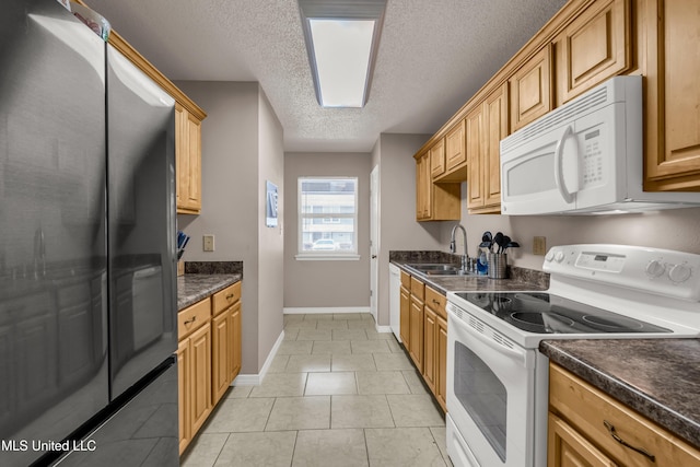257 Highpoint Dr Unit 257, Diamondhead, MS 39525 - kitchen with white appliances, dark countertops, a textured ceiling, and light tile patterned floors
