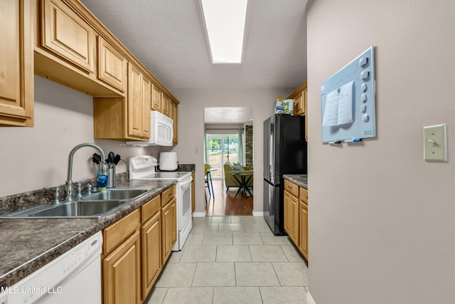 257 Highpoint Dr Unit 257, Diamondhead, MS 39525 - kitchen featuring white appliances, dark countertops, and light tile patterned floors