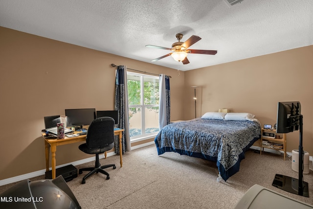 257 Highpoint Dr Unit 257, Diamondhead, MS 39525 - bedroom featuring a textured ceiling, an office area, ceiling fan, and carpet