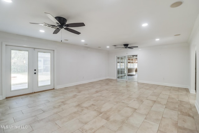 empty room with a wealth of natural light, french doors, and ceiling fan