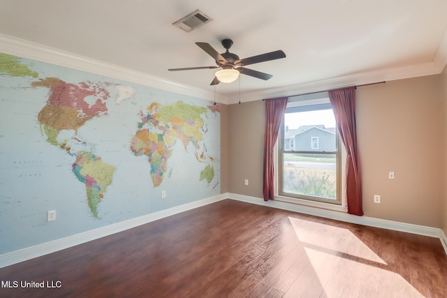 empty room with crown molding, ceiling fan, and dark hardwood / wood-style flooring