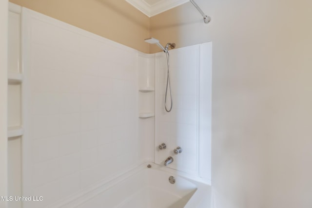 bathroom with ornamental molding and shower / bathing tub combination