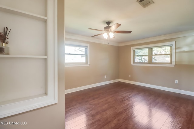 spare room with ornamental molding, ceiling fan, and dark hardwood / wood-style flooring