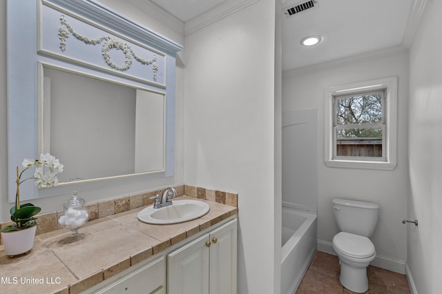 bathroom featuring ornamental molding, toilet, tile patterned flooring, and vanity