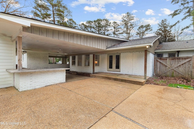 rear view of property with a patio area and french doors