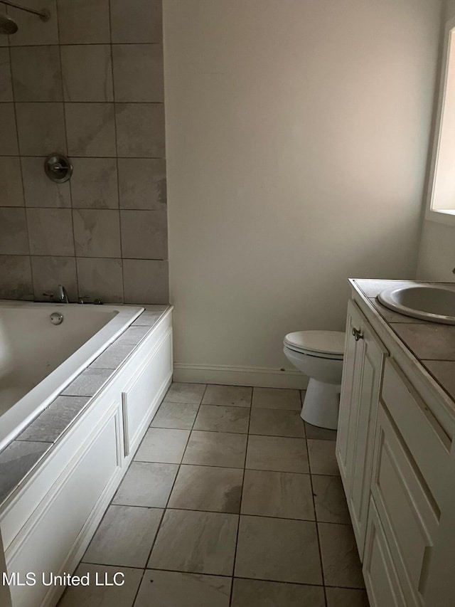 full bathroom featuring vanity, toilet,  shower combination, and tile patterned flooring