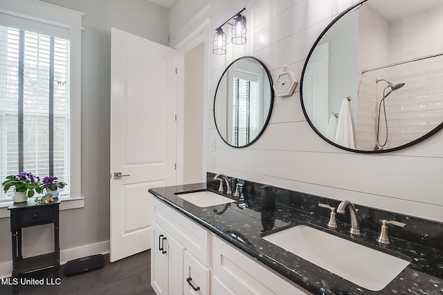 bathroom with vanity, a shower, and tile patterned floors