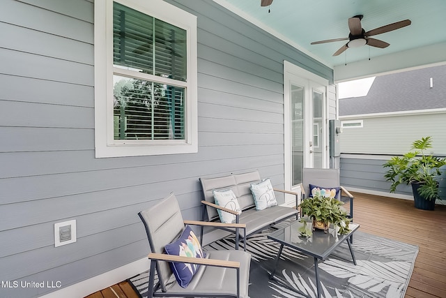 exterior space featuring ceiling fan and an outdoor living space