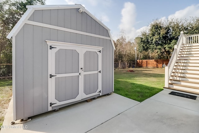 view of outbuilding with a yard