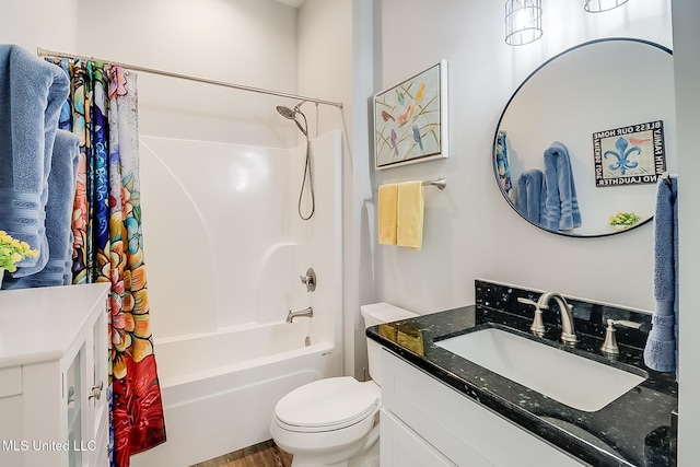 full bathroom featuring shower / bathtub combination with curtain, vanity, and toilet