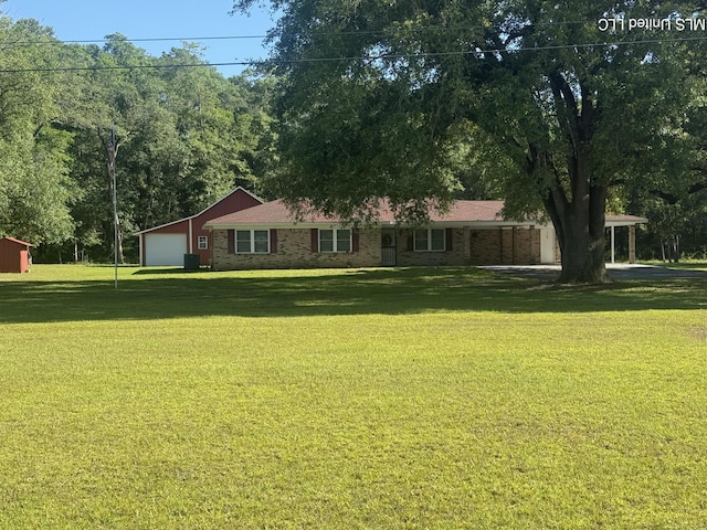 6709 Caraway Rd, Moss Point, MS 39562 - exterior space with brick siding, an attached garage, central AC, and a front yard