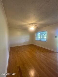 6709 Caraway Rd, Moss Point, MS 39562 - unfurnished room with baseboards and wood finished floors