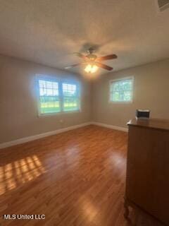 6709 Caraway Rd, Moss Point, MS 39562 - spare room with plenty of natural light, wood finished floors, and baseboards
