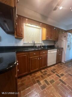 6709 Caraway Rd, Moss Point, MS 39562 - kitchen with brick floor, white appliances, dark countertops, and brown cabinets