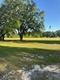 6709 Caraway Rd, Moss Point, MS 39562 - view of property's community featuring view of golf course and a lawn