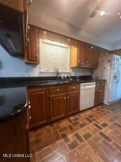 6709 Caraway Rd, Moss Point, MS 39562 - kitchen with brick floor, white appliances, dark countertops, and brown cabinets