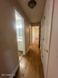 6709 Caraway Rd, Moss Point, MS 39562 - hallway with wood finished floors and baseboards