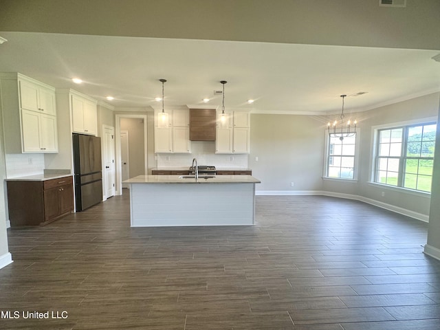 5322 Grays Valley Dr, Hernando, MS 38632 - kitchen featuring ornamental molding, freestanding refrigerator, recessed lighting, decorative backsplash, and white cabinetry