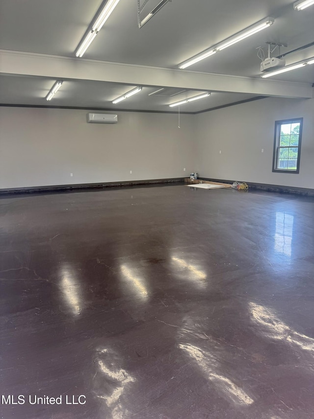 5322 Grays Valley Dr, Hernando, MS 38632 - garage featuring an AC wall unit and baseboards