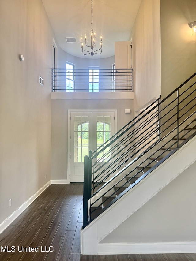 5322 Grays Valley Dr, Hernando, MS 38632 - stairway featuring a chandelier, wood finished floors, a high ceiling, and french doors