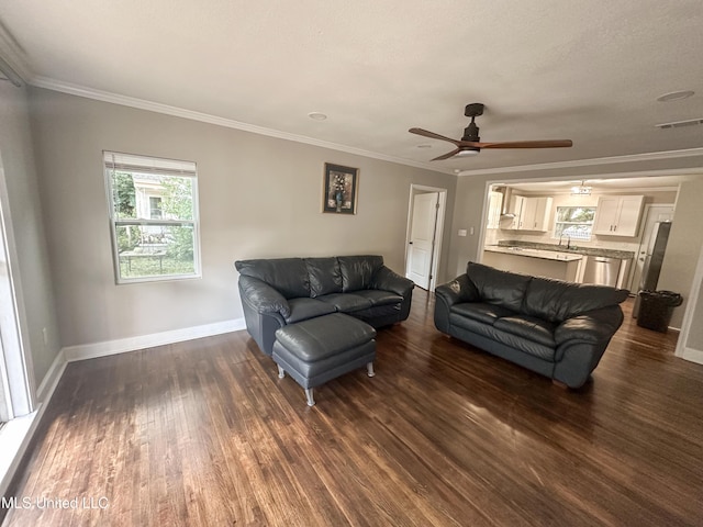 1630 Hollywood Blvd, Biloxi, MS 39531 - living room with dark wood-style flooring, crown molding, and a ceiling fan