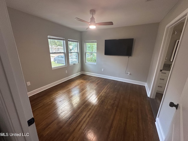1630 Hollywood Blvd, Biloxi, MS 39531 - unfurnished room featuring dark wood-style floors and a ceiling fan