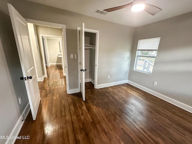 1630 Hollywood Blvd, Biloxi, MS 39531 - unfurnished bedroom with dark wood-style floors, a closet, and a ceiling fan