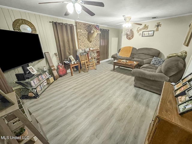 903 Kenwood Ln, Natchez, MS 39120 - living room with ceiling fan, ornamental molding, and light hardwood / wood-style floors